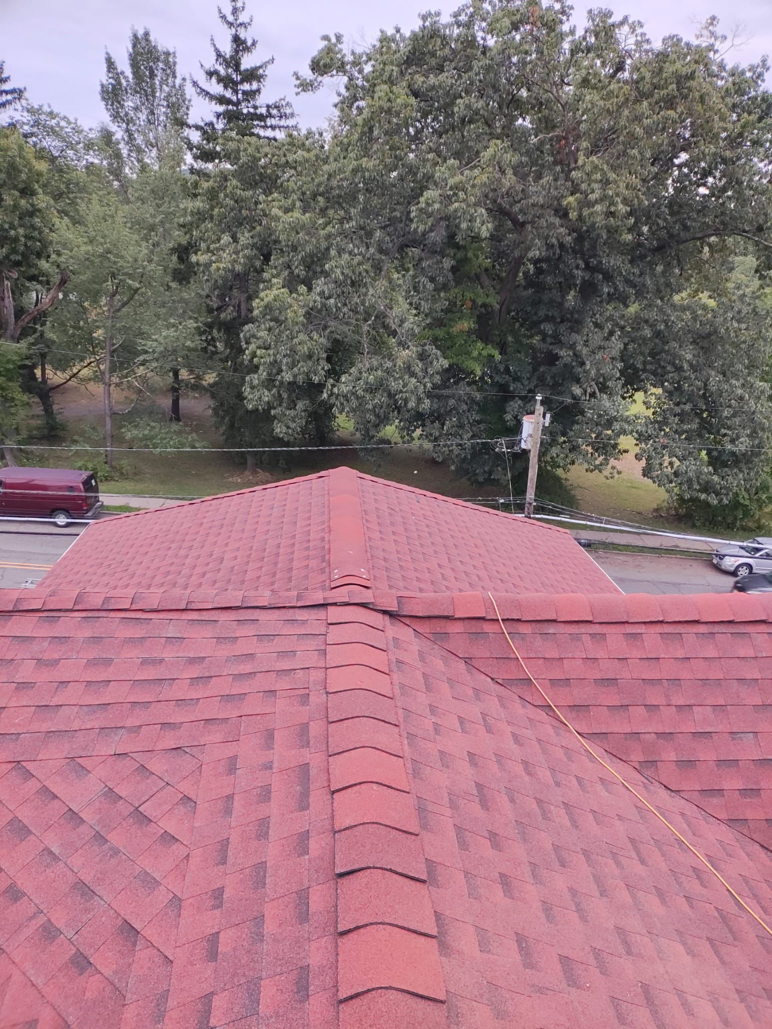 Finished hip roof with ridge cap installed in Bergen County