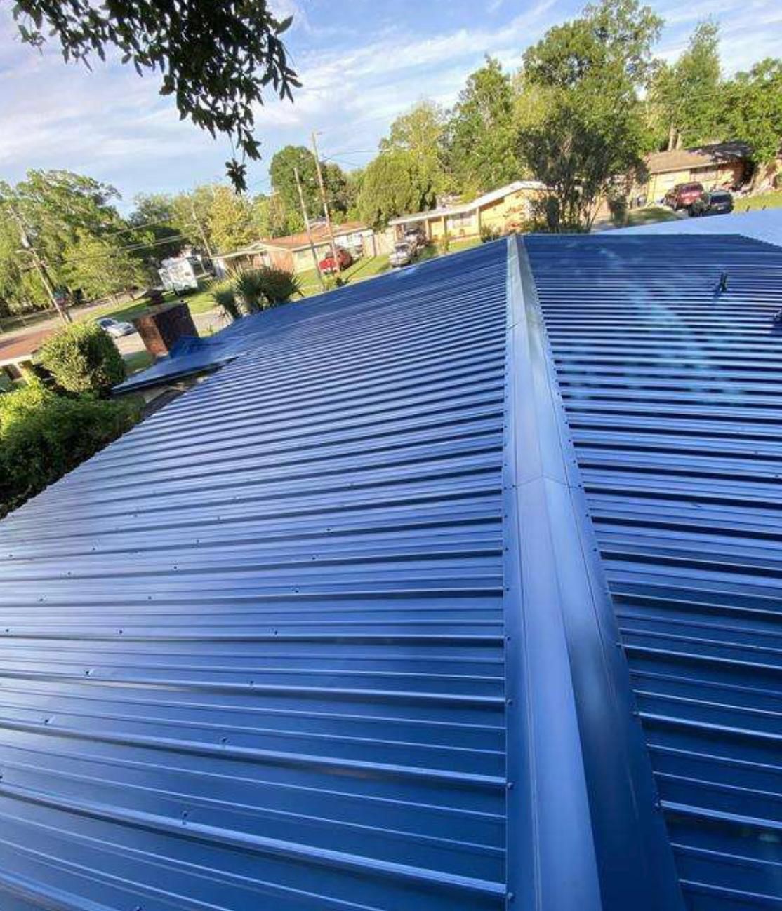 Blue corrugated metal roof completed by Randy's Roofing Construction