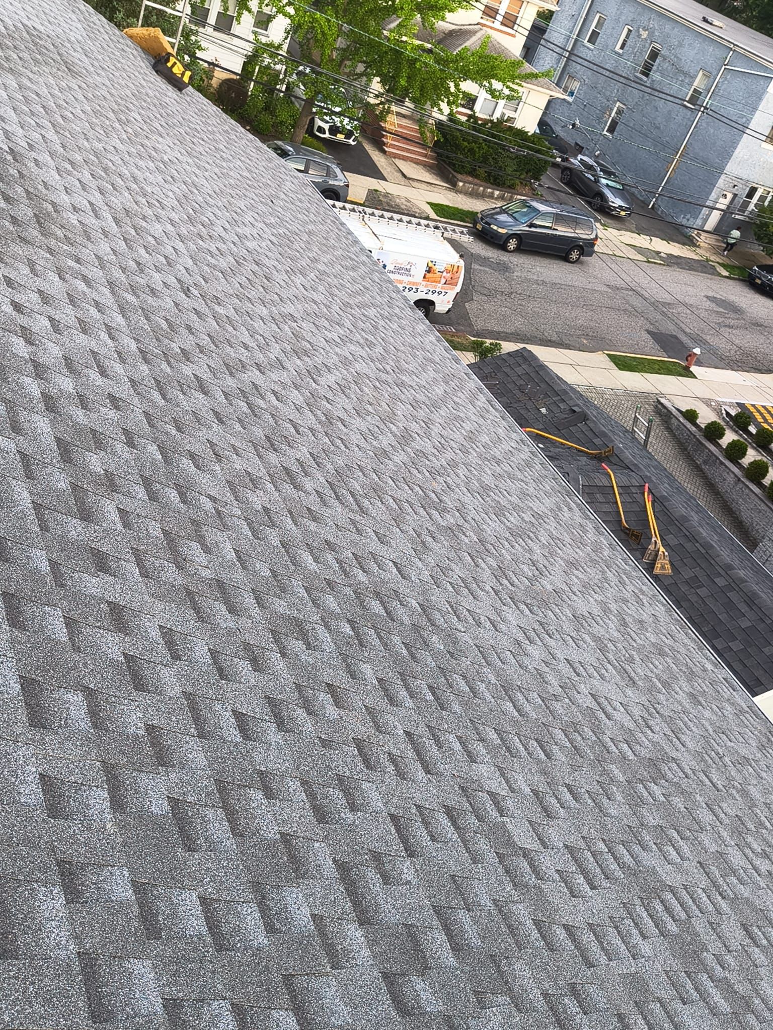 Newly completed gray architectural asphalt roof by Randy's Roofing Construction