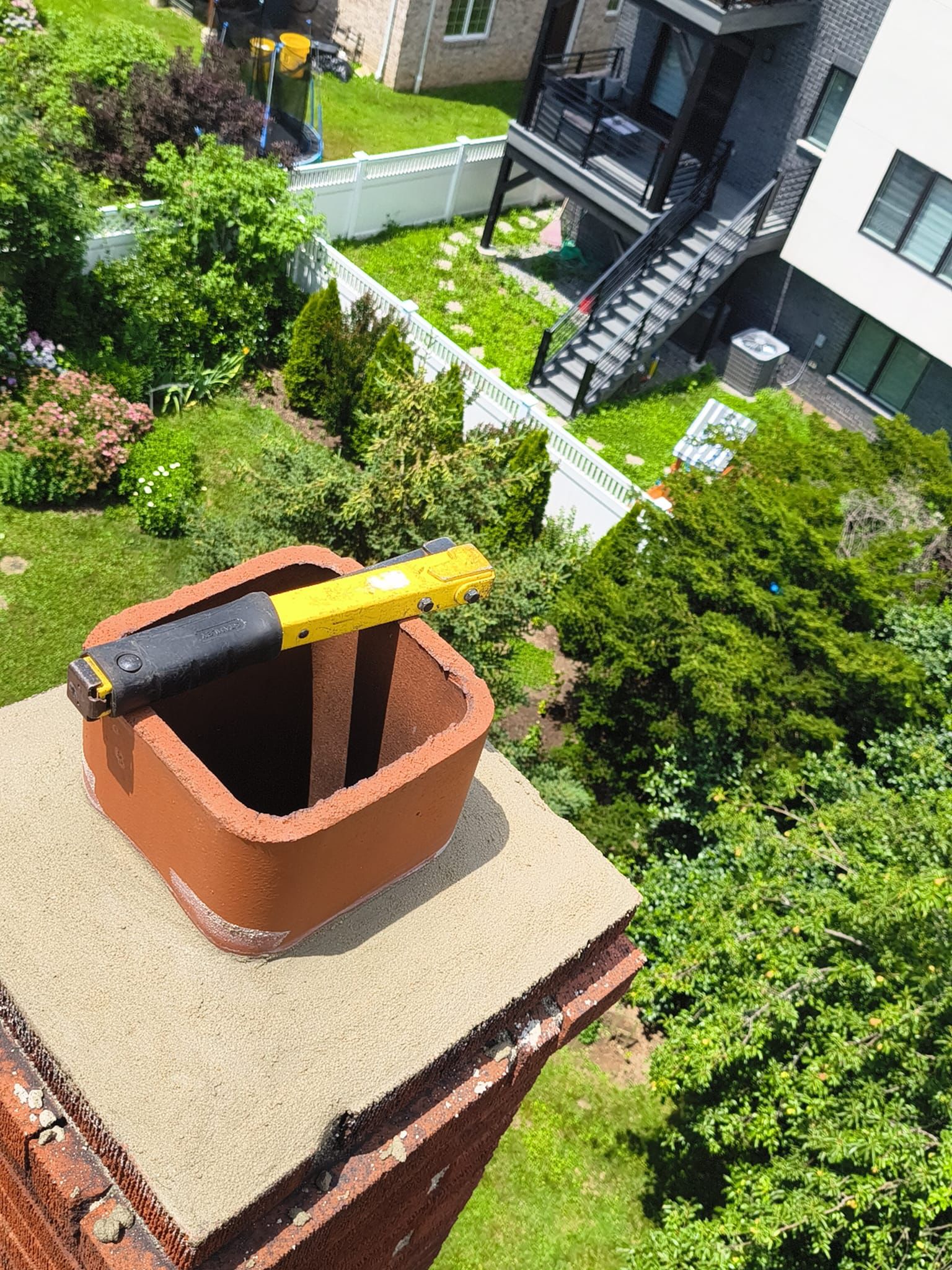 Chimney crown rebuild with terracotta clay flue liner ready for cap install