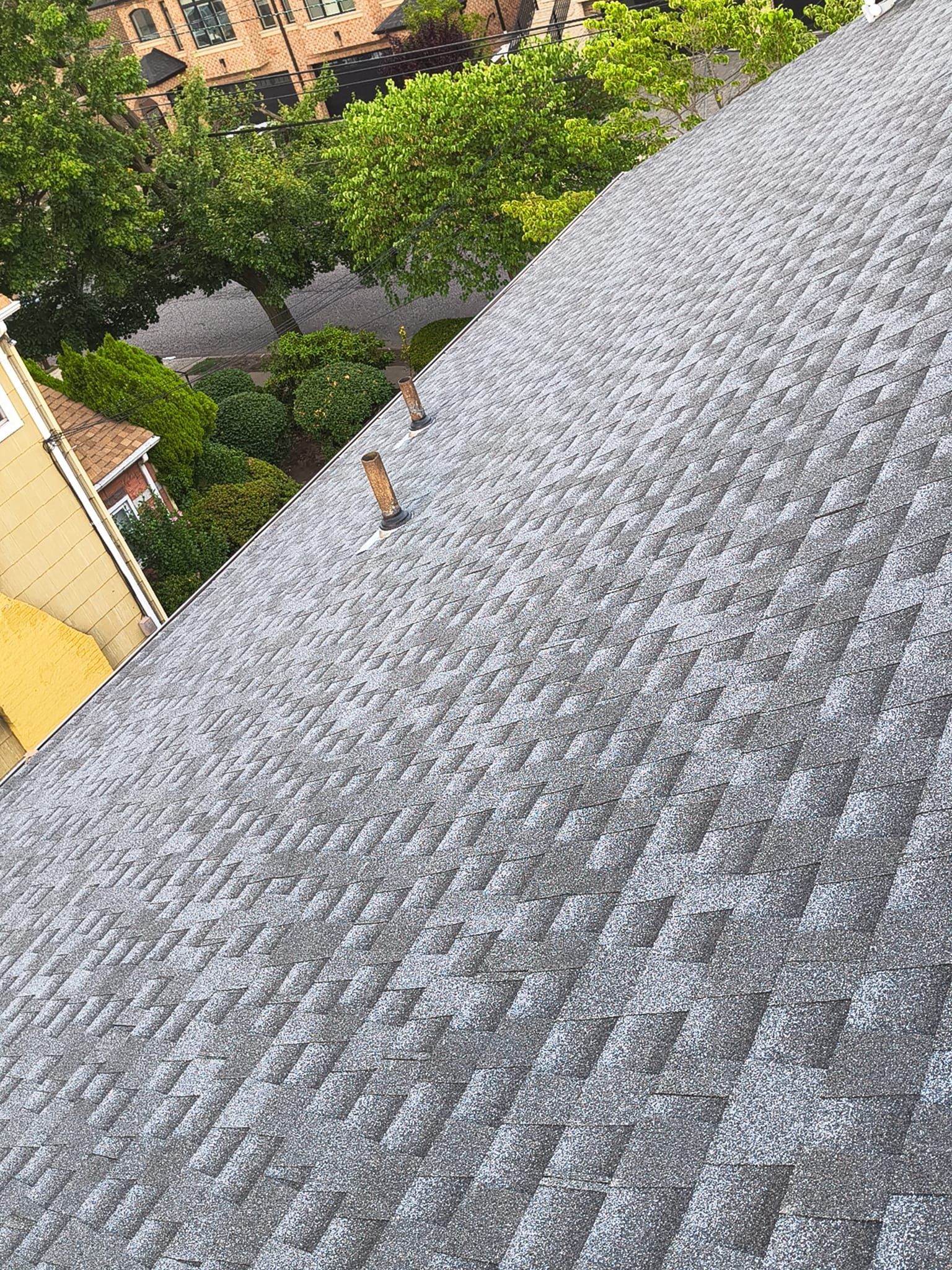 Completed architectural asphalt shingle roof on a Northern NJ home by Randy's Roofing Construction