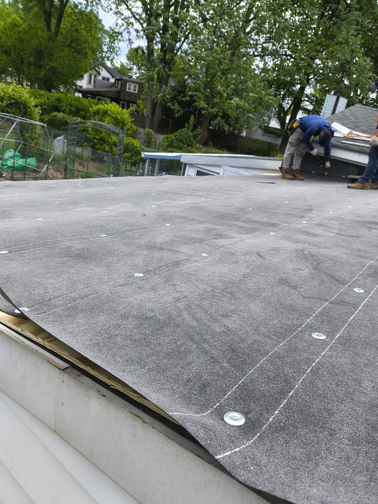 EPDM membrane installation on a flat roof in Edgewater