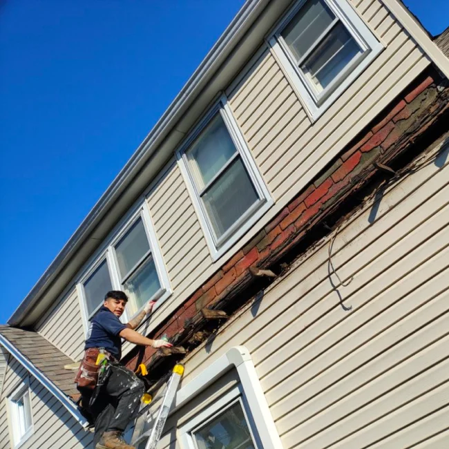 Randy's crew repairing fascia and siding on a Northern NJ home
